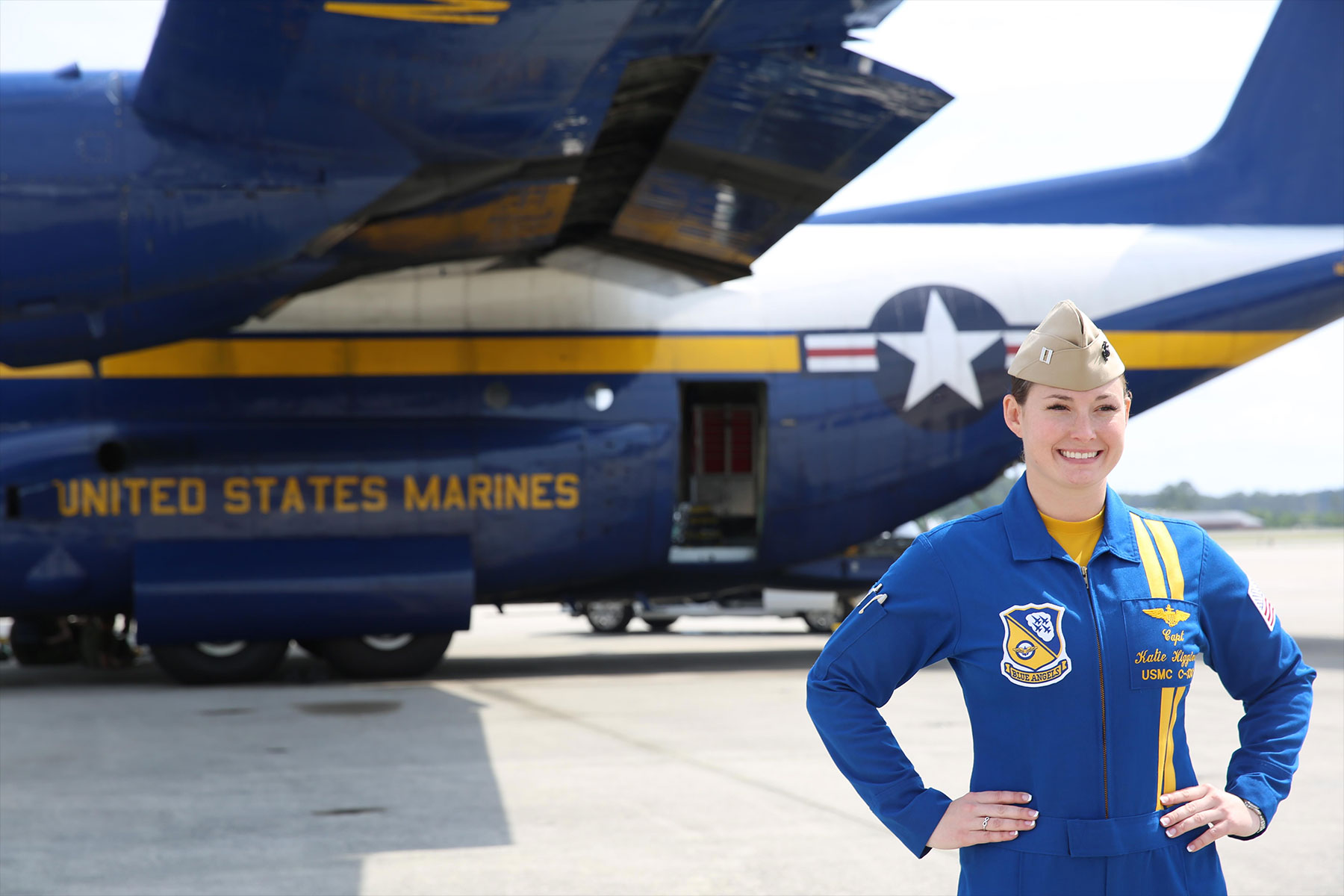 Capt. Katie Higgins poses in front of "Fat Albert", the U.S. Navy Blue Angel's C-130J Super Hercules prior to the 2016 Marine Corps Air Station Cherry Point air show. (U.S. Marine Corps/Mackenzie Gibson) 