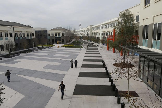 Facebook employees are shown on the campus in Menlo Park, Calif.