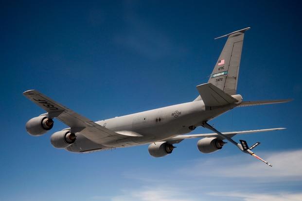 A KC-135R Stratotanker from the 434th Air Refueling Wing at Grissom Air Reserve Base, Indiana, flies over Ohio shortly after refueling a C-17 Globemaster III from the 445th Airlift Wing at Wright-Patterson Air Force Base, Ohio, June 18, 2014.