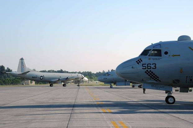 A P-3C Orion maritime patrol aircraft, from the Golden Swordsmen of Patrol Squadron (VP) 47, transits the flight line of Kadena Air Base.