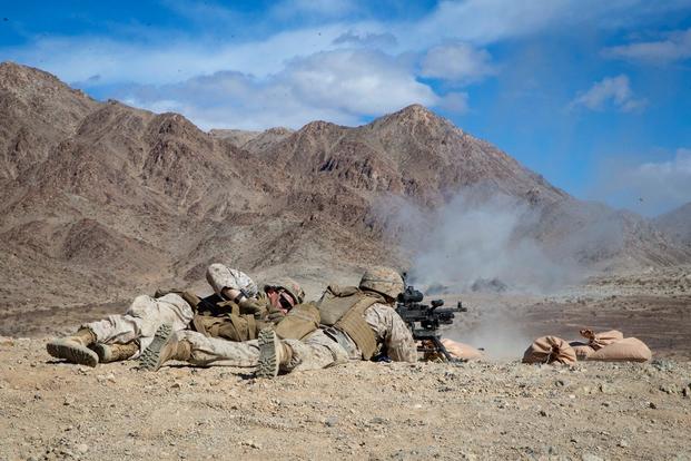 U.S. Marines with 3rd Battalion, 3rd Marine Littoral Regiment, fire the M240B machine gun on range 400, a company attack range, during Initial Training Exercise (ITX) at Marine Corps Air Ground Combat Center, Twentynine Palms, California, March 4, 2022.