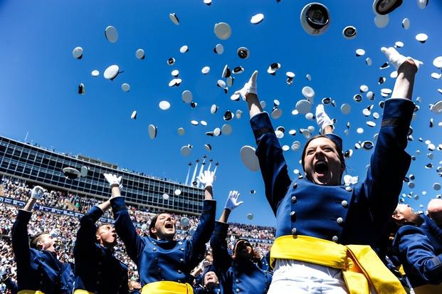 Newly-minted Air Force second lieutenants celebrate during their graduation at the Air Force Academy, Colorado, May 24, 2017. 