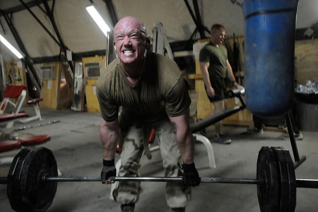 Petty Officer 2nd Class Eric Clark performs a Romanian deadlift in the Camp Krutke Seabee Gym at Camp Leatherneck, Afghanistan.