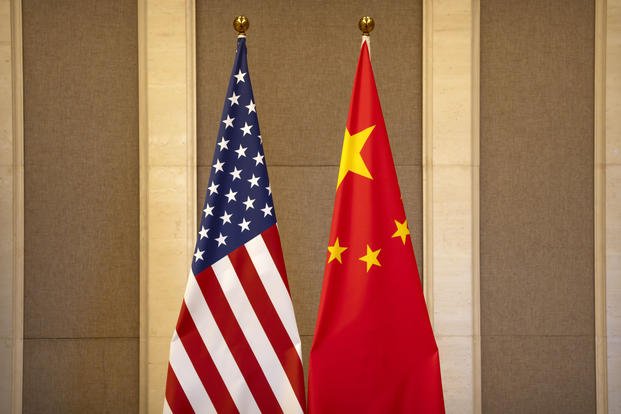 United States and Chinese flags are set up before a meeting