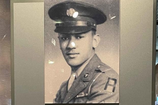 Exhibit featuring Waverly Bernard Woodson Jr. at Normandy American Cemetery visitors center