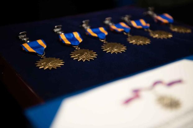 Air Medals sit on display during a ceremony at Travis Air Force Base