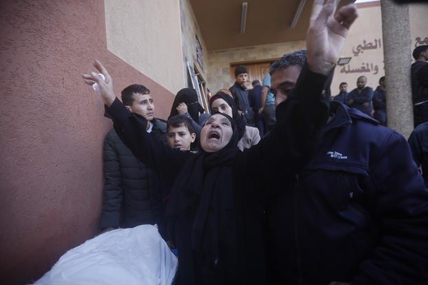 Palestinians attend a funeral of their relatives killed in the Israeli bombardment of the Gaza Strip