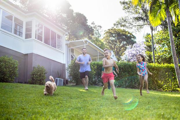Family playing in yard