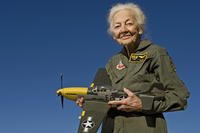 Betty “Tack” Blake, 91, holds a model of a P-51 Mustang, her favorite aircraft to fly, in front of her home in Scottsdale, Ariz. Blake joined the first class of WAFs (later named Women Airforce Service Pilots). During World War II, she was assigned as a transport pilot, ferrying 36 different types of aircraft across America. (U.S. Air Force photo by Tech. Sgt. Bennie J. Davis III)