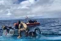 Coast Guardsmen from the cutter Harriet Lane interdict $69 million worth of cocaine from a drug-trafficking semi-submersible in the Eastern Pacific Oct. 24, 2019 (video screengrab via Coast Guard)