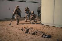 U.S. Marines approach a simulated casualty during Integrated Training Exercise 2-19.