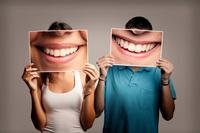 People holding smiling mouth photos in front of their faces
