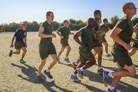 Recruits run faster during a physical training session.