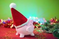 piggy bank wearing a santa hat to signify keeping a budget for christmas