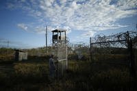 soldier closes the gate at the now abandoned Camp X-Ray, Guantanamo Bay, Cuba