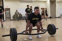 A guardsman warms up before the deadlift portion of the physical fitness event of the 2021 Arizona Best Warrior competition at Camp Navaho, Bellemont, Arizona.