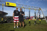The heads of 24 Hour Fitness and TRX pose at The TRX Challenge in San Francisco.