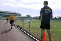 Airmen take part in a 1.5-mile run as part of the Navy SEAL physical screening test.