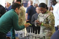 A service member networks with an employer during a Hiring Our Heroes event at Joint Base Lewis-McChord.