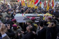 Members of an Iraqi Shiite militant group carry the coffin during the funeral of a fighter with the Kataib Hezbollah