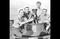 The Coast Guard cutter Campbell's crew is shown with its shipmate and mascot, Sinbad, in the North Atlantic in 1943.