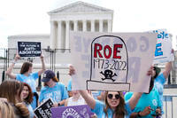Demonstrators protest about abortion outside the Supreme Court