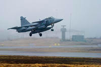 One of three Swedish Air Force JAS 39 Gripen fighter aircraft takes off from the Blekinge Wing F17