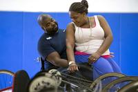 Shundra Johnson, right, and her husband Coast Guard Lt. Sancho Johnson share a moment during the Navy’s wounded warrior training camp for the 2015 DoD Warrior Games in Port Hueneme, Calif., May 29, 2015. (DoD News photo by EJ Hersom)